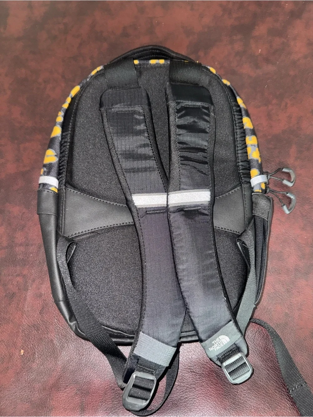 The North Face Black and Yellow Leopard Print Mini Backpack